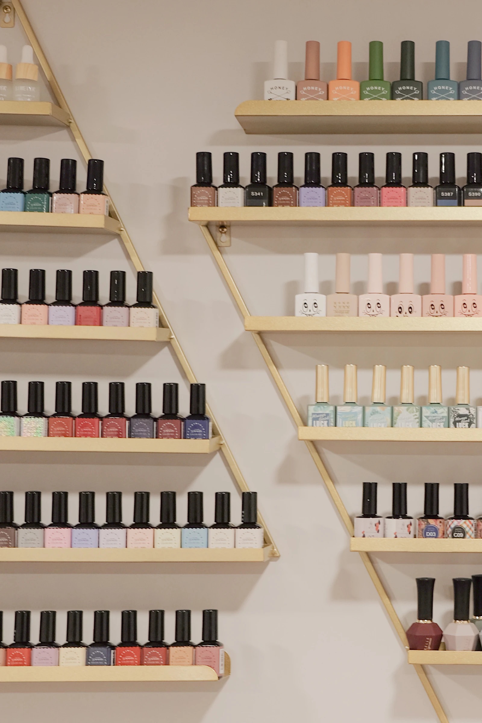 Rows of polish on gold shelves