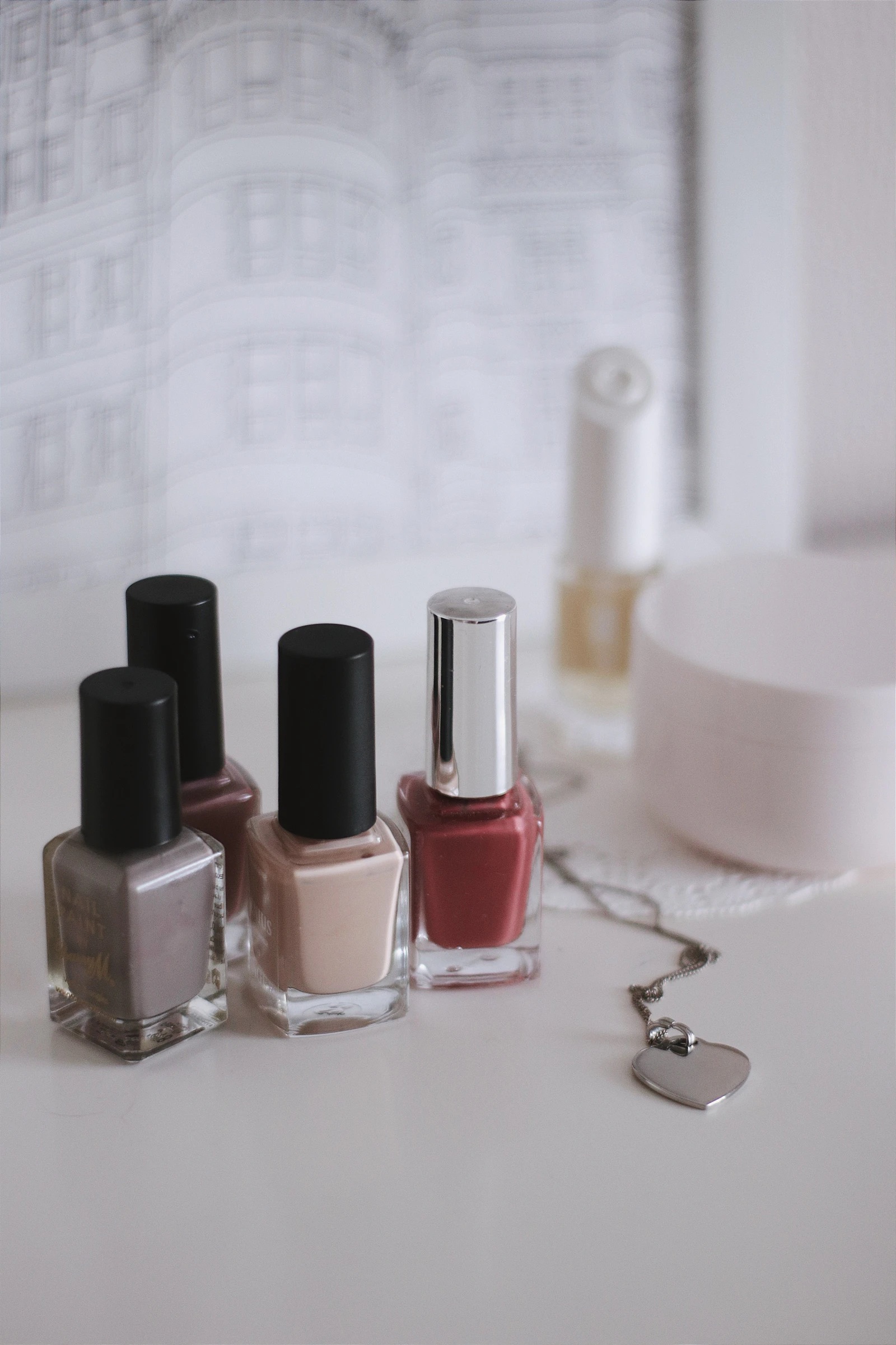 Pink and black polish bottles